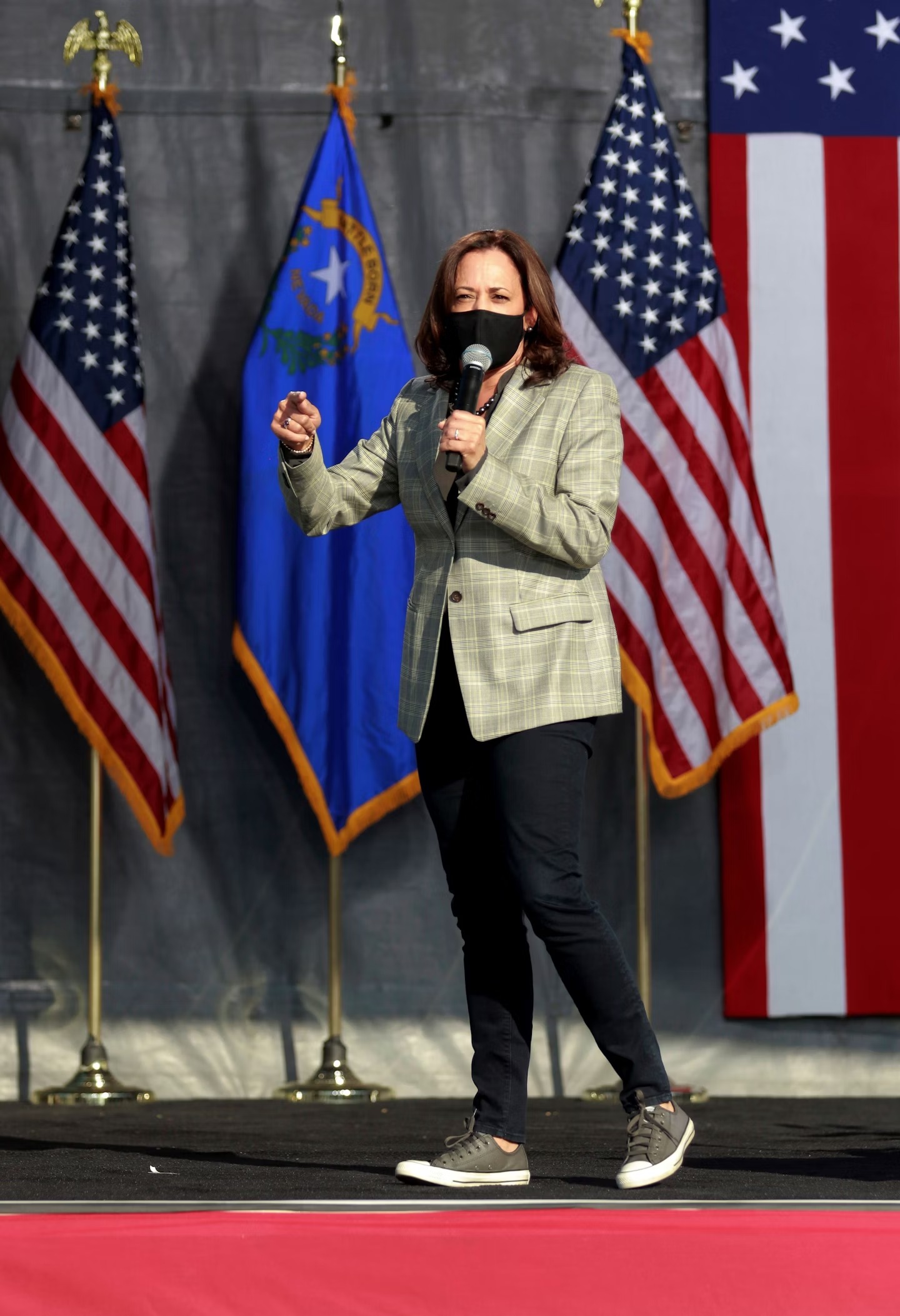 Kamla Harris in Converse jeans and a formal suit