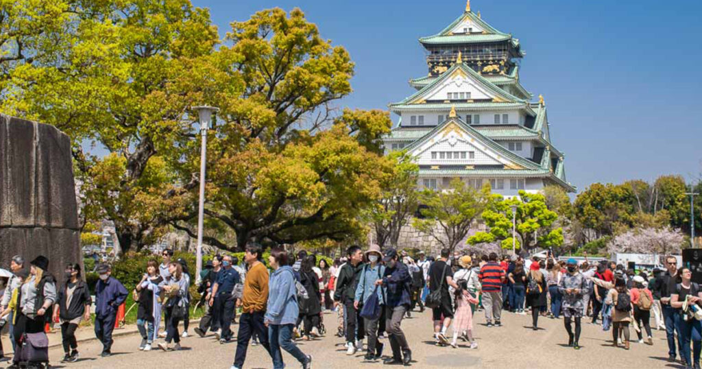 A picture of a tourist in the courtyard of Osaka Castle 