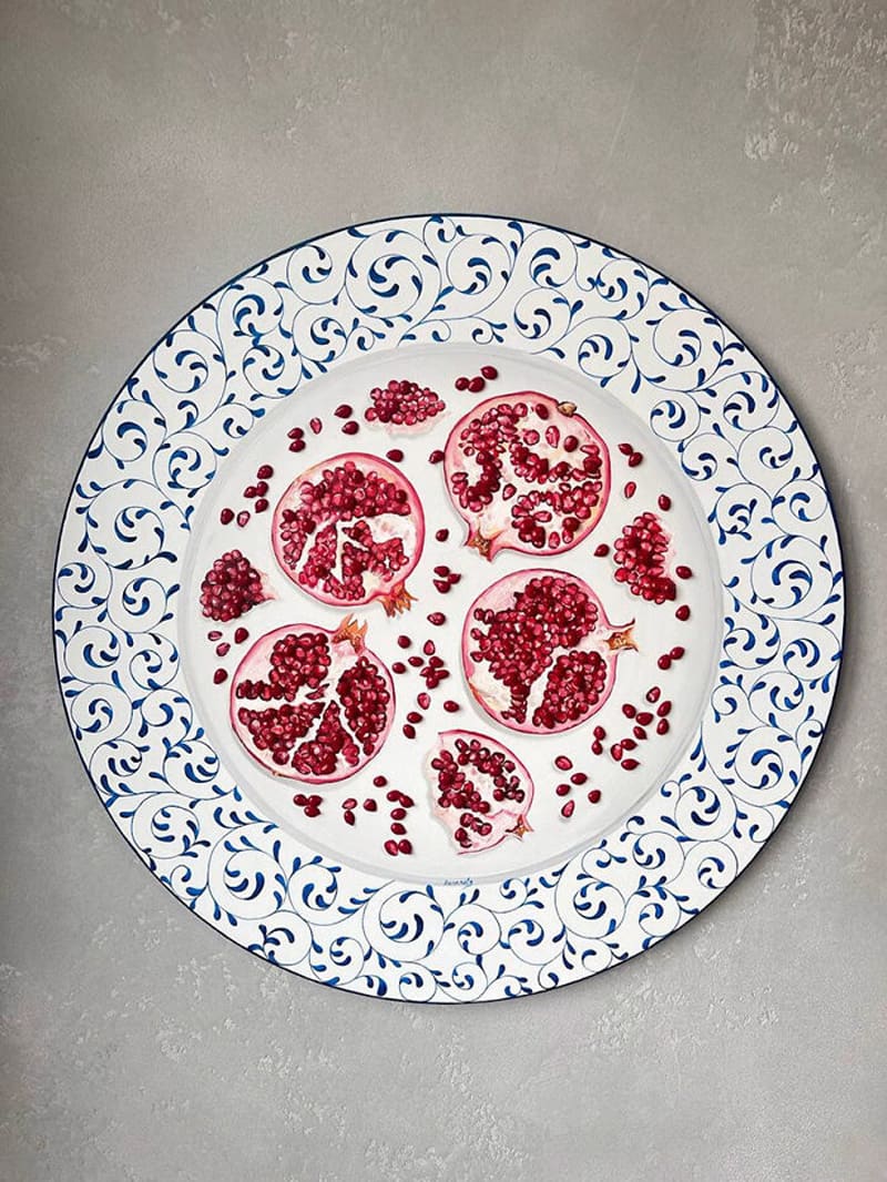 Pomegranate pieces and seeds paied on the plate