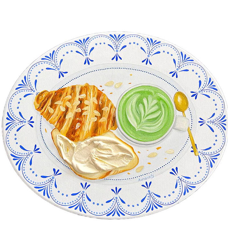 Cut croissas with green lettuce on the plate