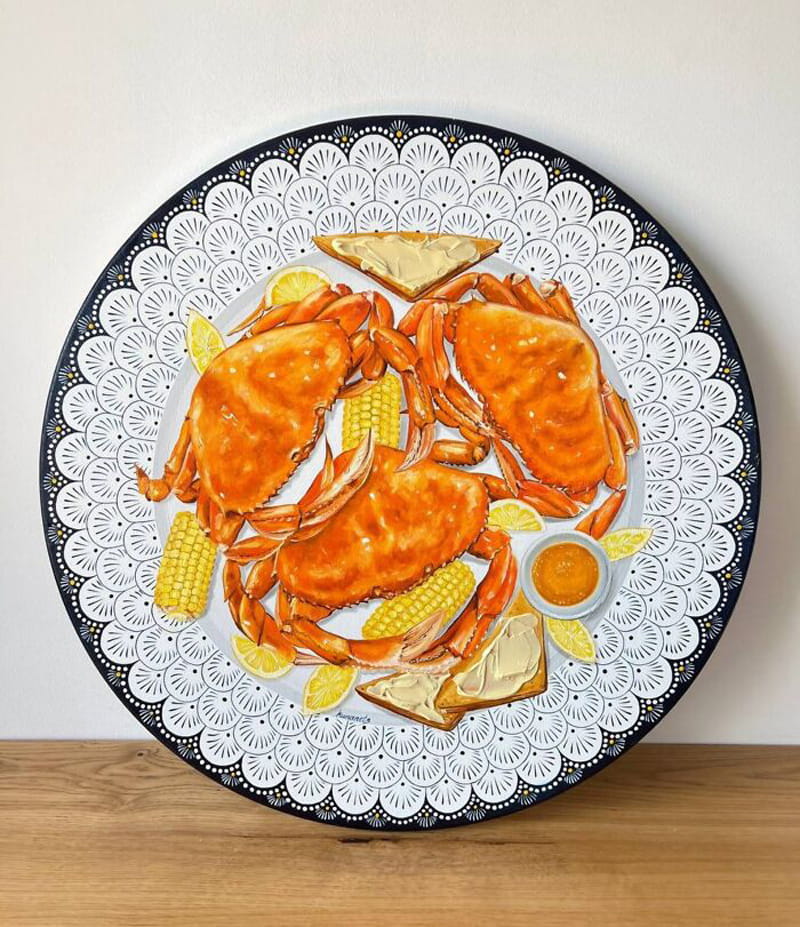 Drawing of three cooked crabs on a plate