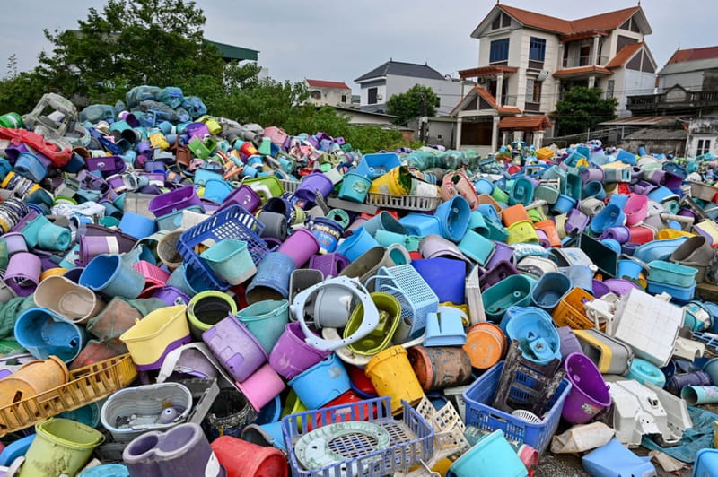 A pile of plastic waste at a recycling site next to a resideial area on the outskirts of Hanoi, Vietnam