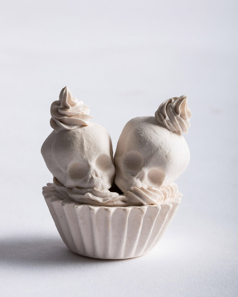 Porcelain skull cup sculpture with cream