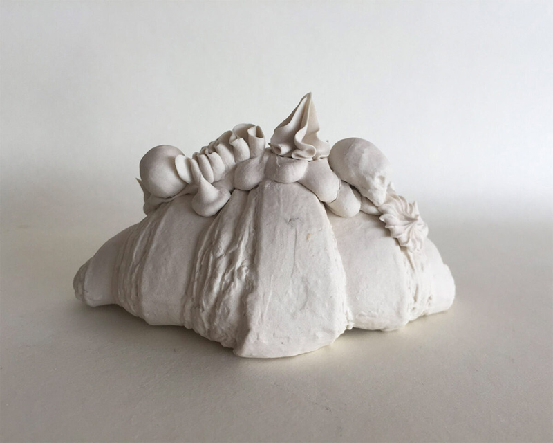 Croissa and skull porcelain figurine