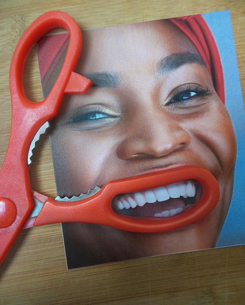 Combined photo of lips and scissors