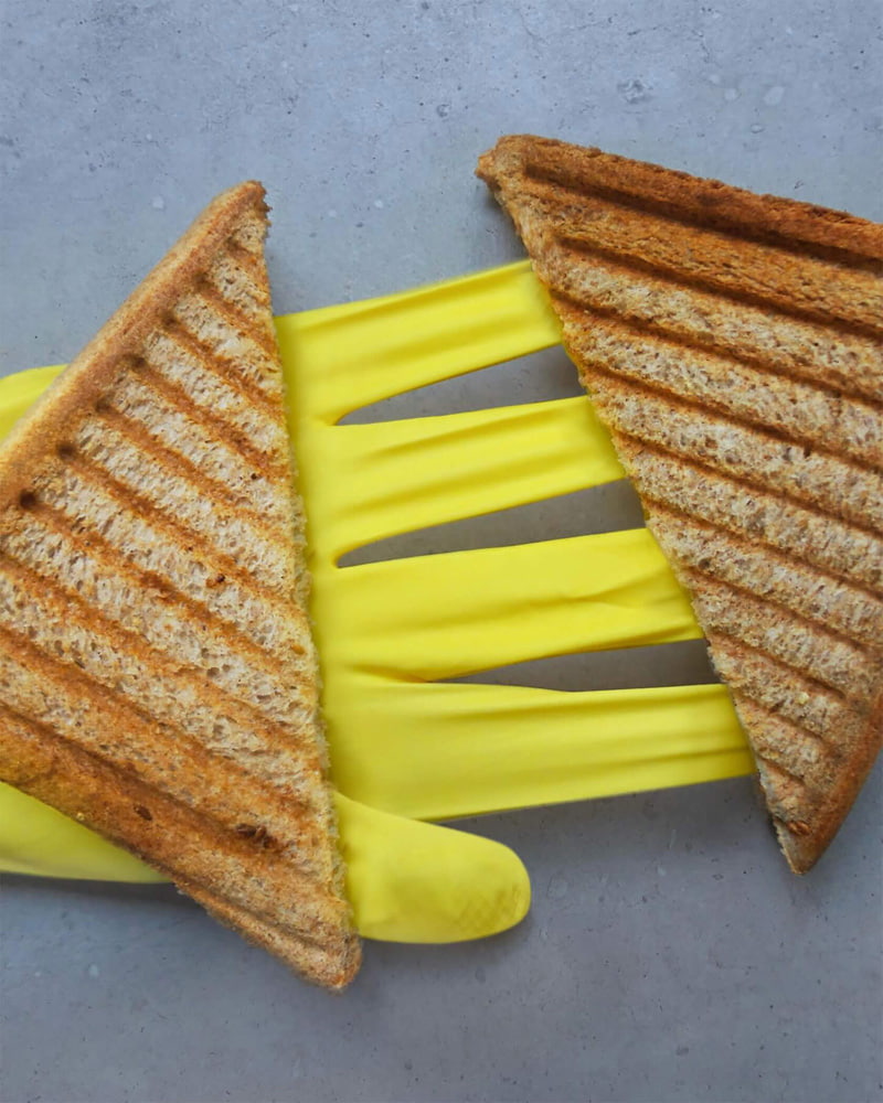 The combination of gloves and toasted bread in the photo