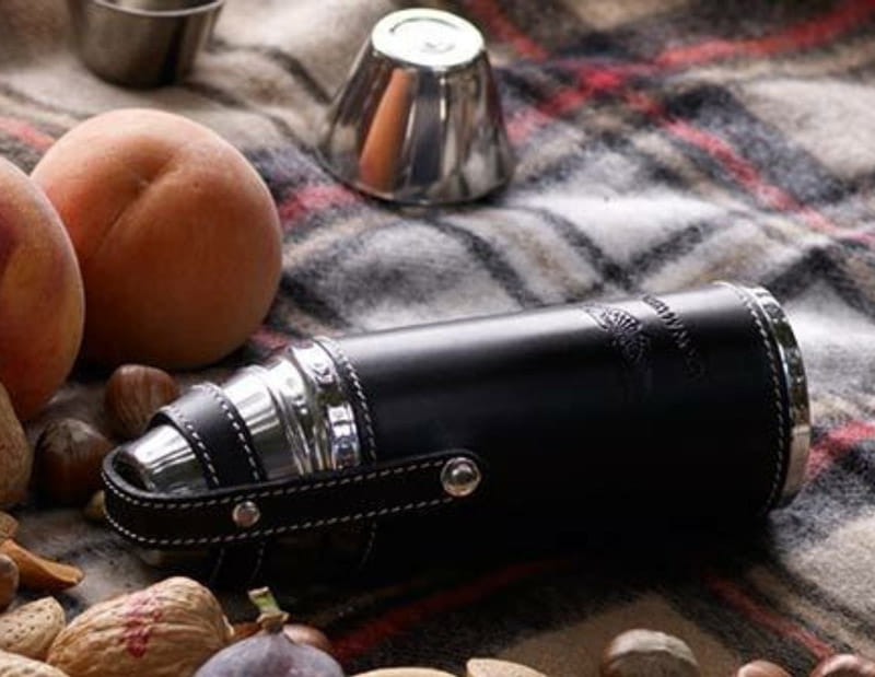 Blue travel flask with open lid, photo source: Travel Leisure, photographer: unknown
