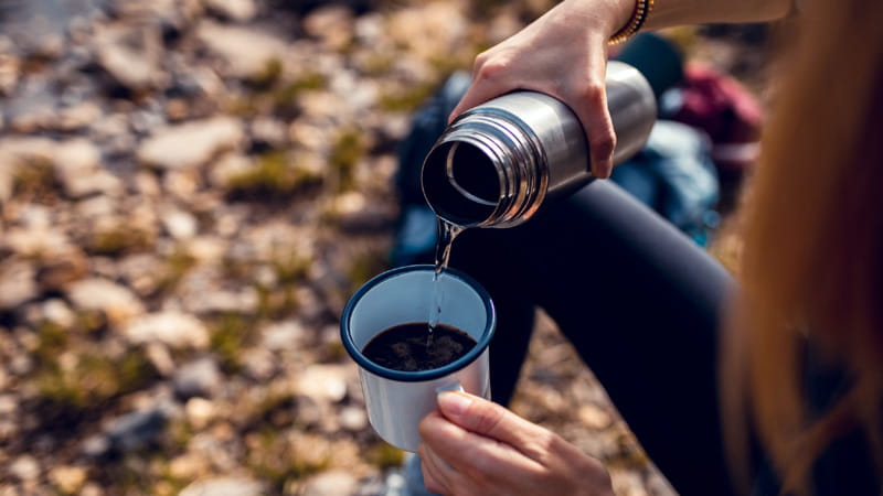 Pouring tea io a flask, photo source: The Week website, photographer: unknown