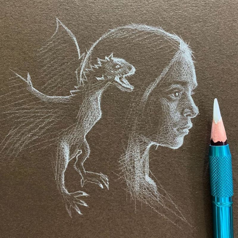Drawing a girl's profile with a white pencil