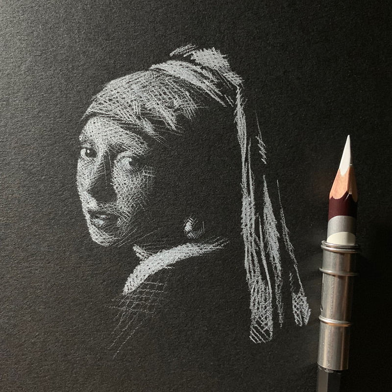 Drawing of a girl with pearl earrings in white pencil