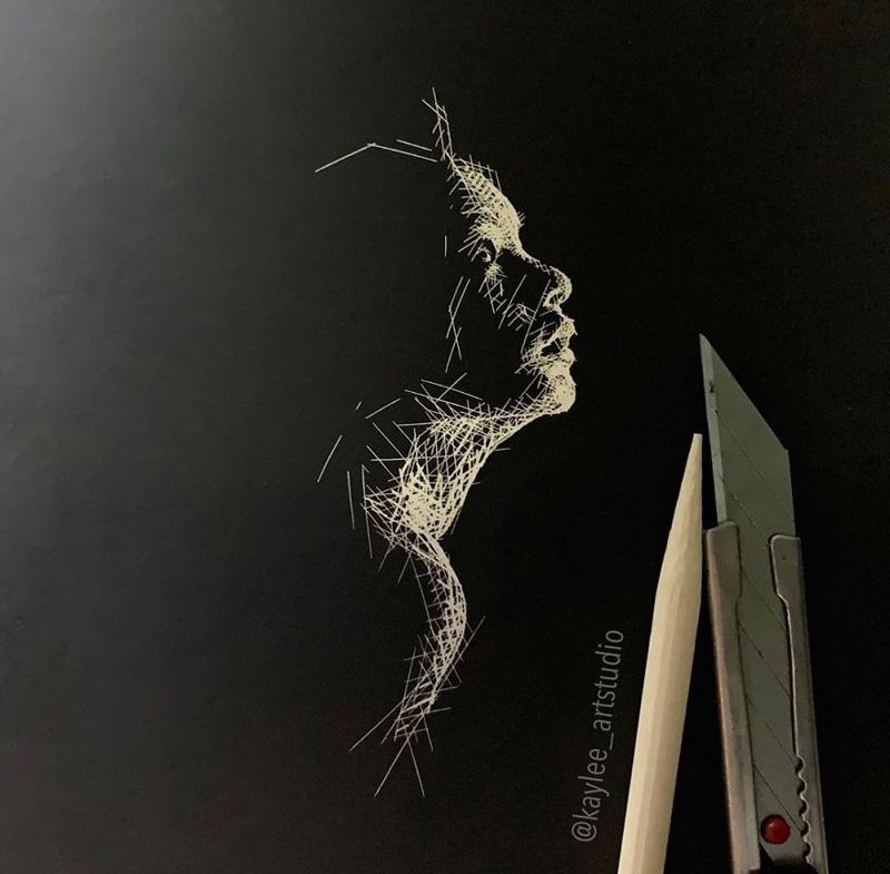 White pencil drawing of a young woman's profile