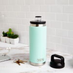 Blue travel flask with open lid, photo source: Travel Leisure, photographer: unknown