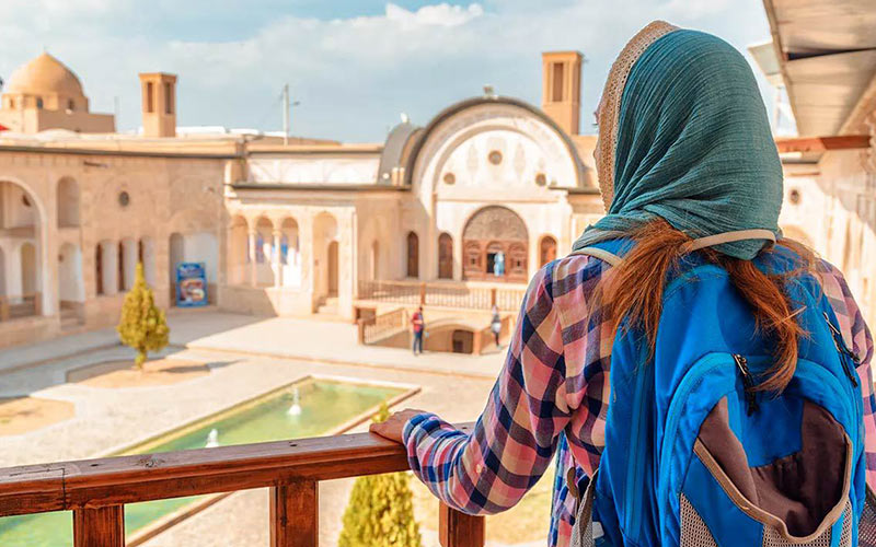 A female tourist in a historical Iranian house
