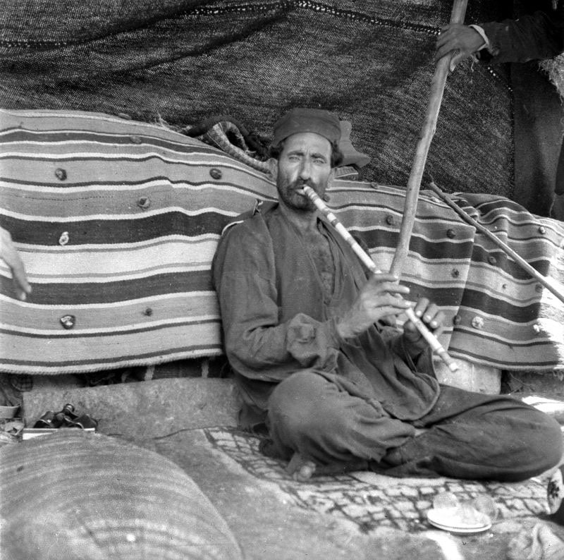 Nomadic female flute man in ancie Iran
