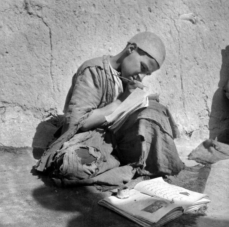 A boy practicing writing with Duat in old Iran