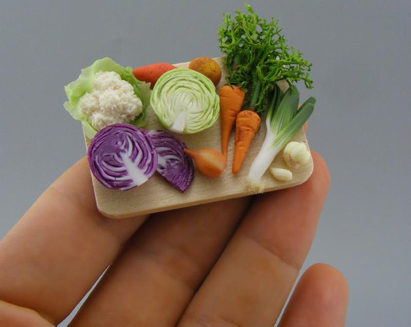 A miniature board coaining vegetables made by Shai Aaron