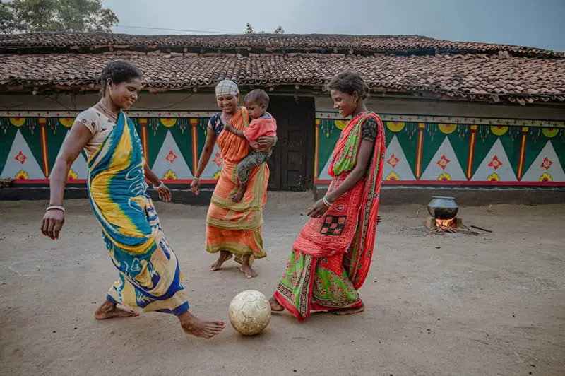 Indian women footballers in the street