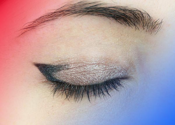 Drawing the eyeliner on one third of the eye for big eyes