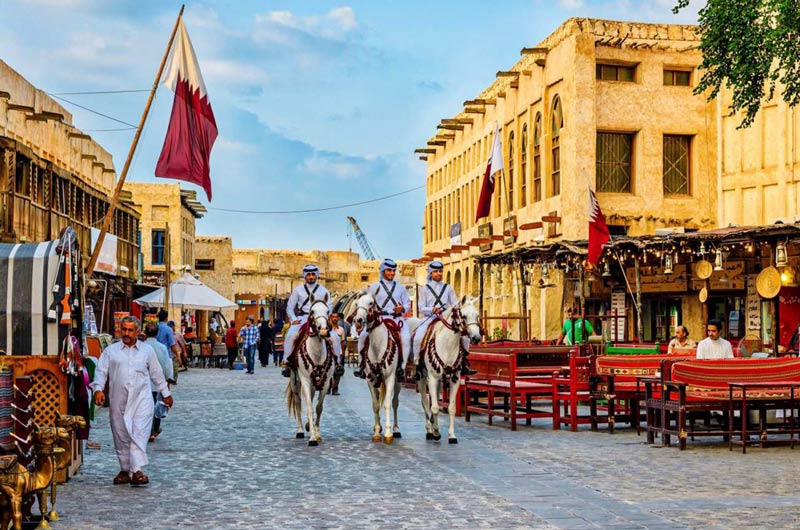 Arab horse riders in Souq Waqif market in Qatar; Photo Source: Bookingqube, Photographer: Unknown