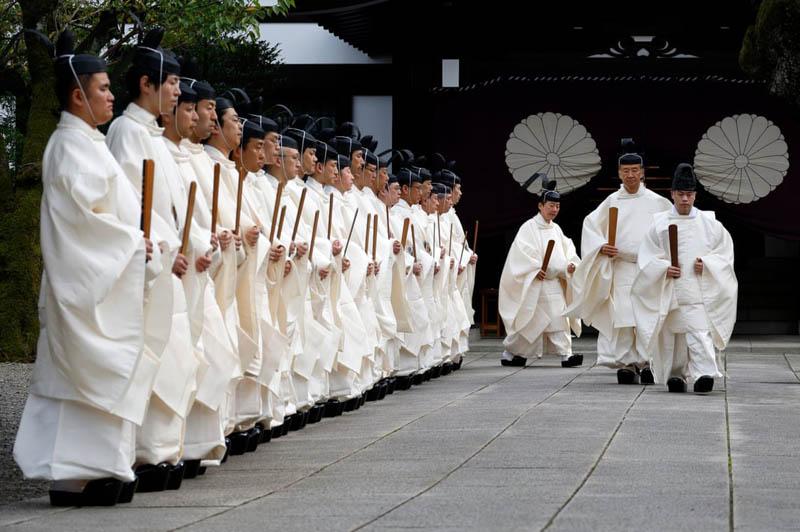 Shio priests during the purification ceremony during the three-day autumn festival at Yasukuni Temple in Tokyo; Photo source: the guardian; Photographer name: Franck Robichon