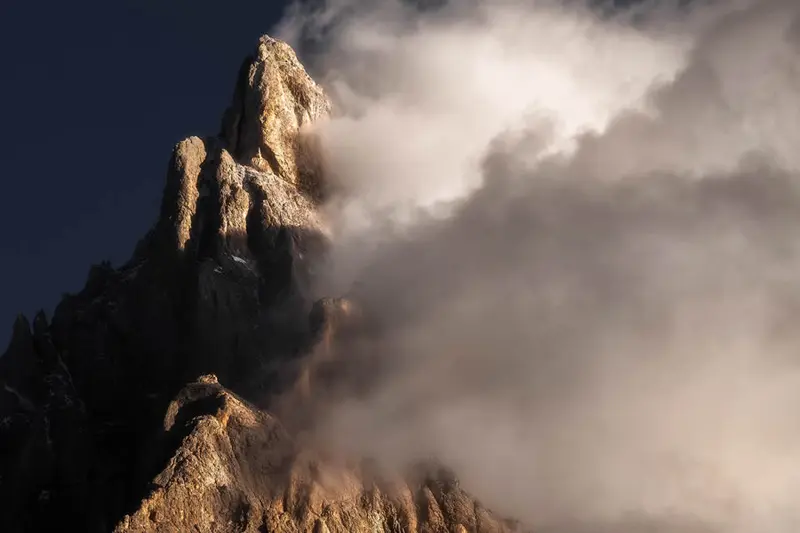 Alpine peaks in the fence of clouds
