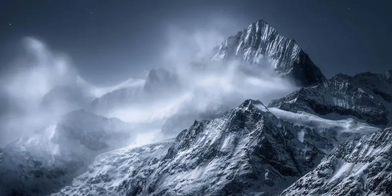 Fog in the snowy Alps