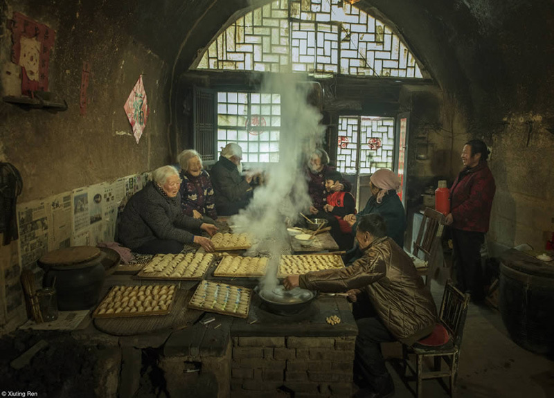 Asian women cooking dumplings