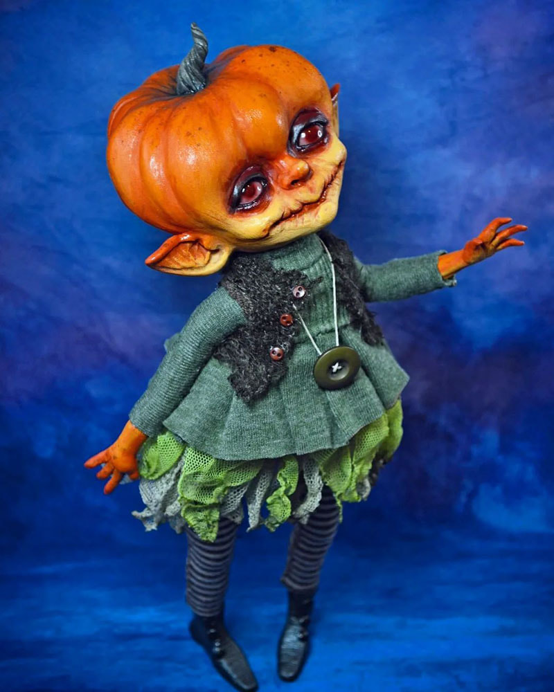A doll with a pumpkin head