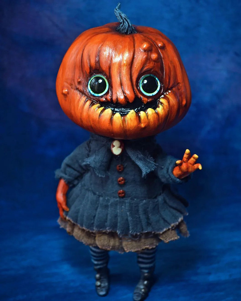 Girl doll with pumpkin head