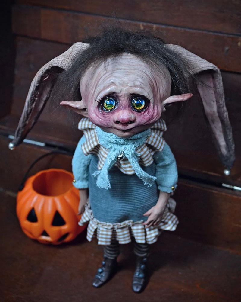 A small and oppressed monster doll