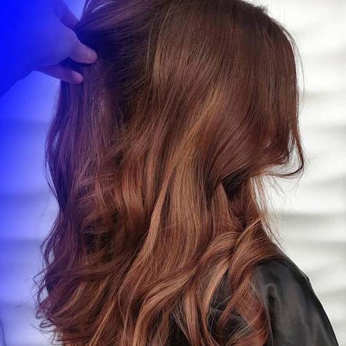 Smoky chocolate hair color model without highlighting at home