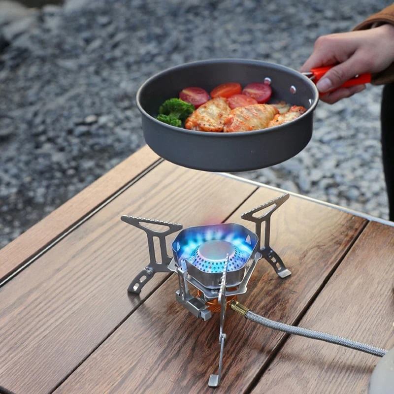 Cooking food on the travel stove; Photo Source: Camp N Gear website. Photographer: Unknown