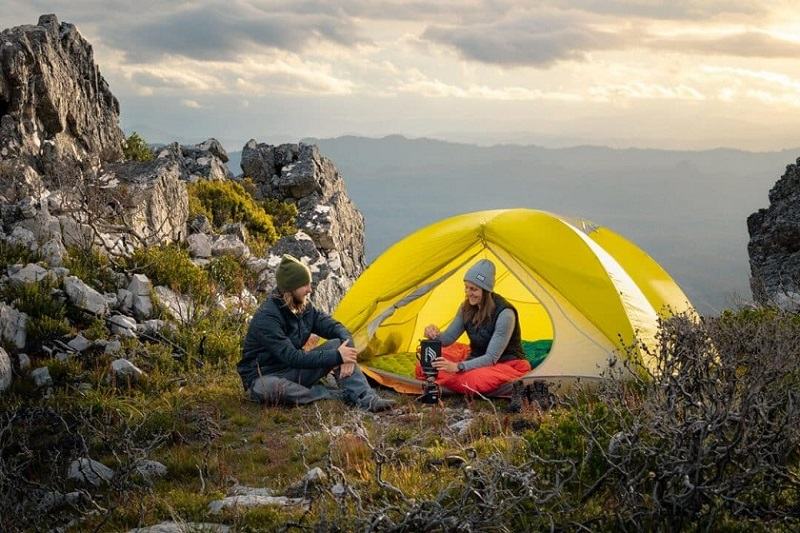 Using a travel torch in double camping; Photo source: Tracks Less Traveled website. Photographer: Unknown