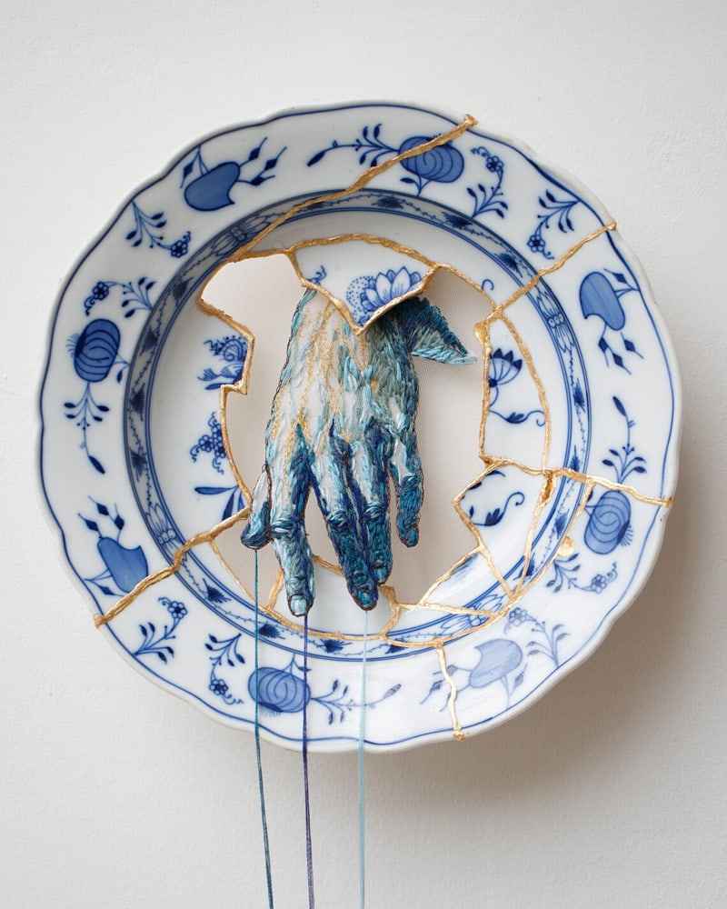 Blue hand drawing on a porcelain plate
