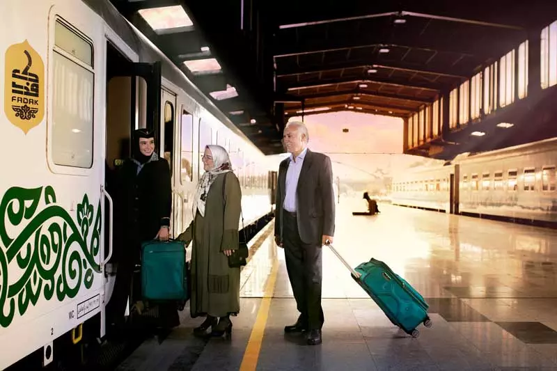 Passengers eering the Fadak train carriage