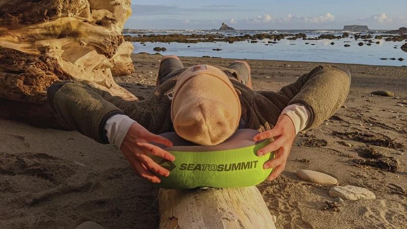 3-to-Summit pillow on the beach; Photo source: Website: outdoorgearlab.com. Photographer: Uncertain