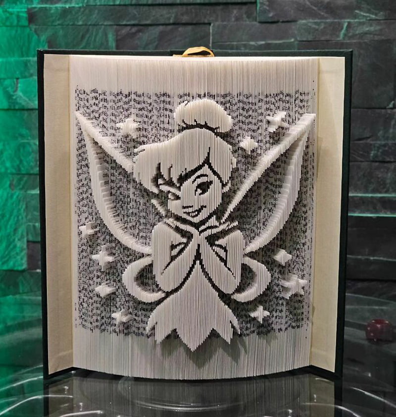 Book statue of Disney character, Tinker Bell