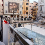 Temporary pool for throwing coins in the fountain of Troy, Italy