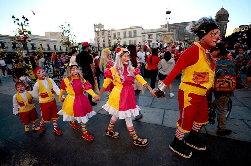  A family of clowns on National Clown Day in fro of Guadalajara Cathedral in <a href=