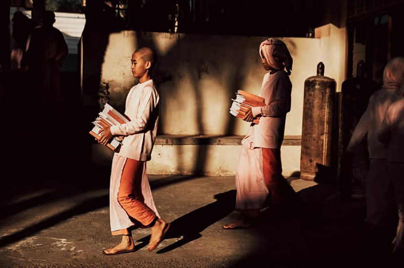 Teenagers carrying books