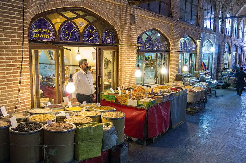 Dried fruit shop in Tehran's Grand Bazaar. Source: Wikimedia; Photographer: Aoine Taveneaux