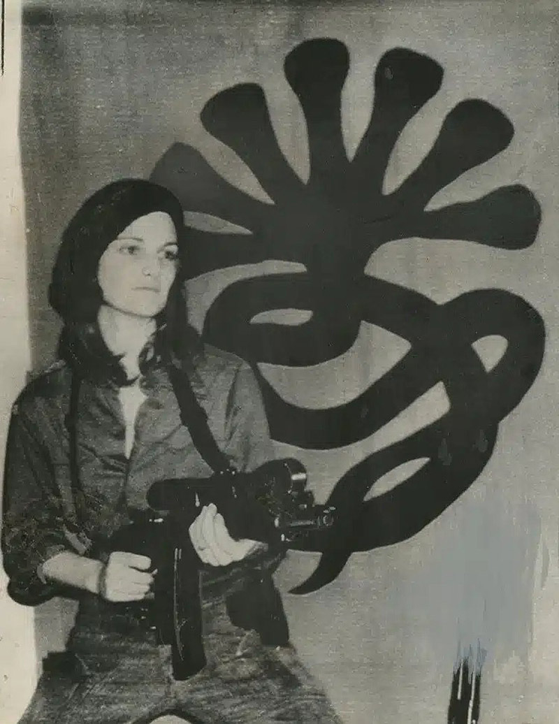 American Patricia Hearst posing next to members of the Symbionese Liberation Army in April 1974; Photographer: Unknown
