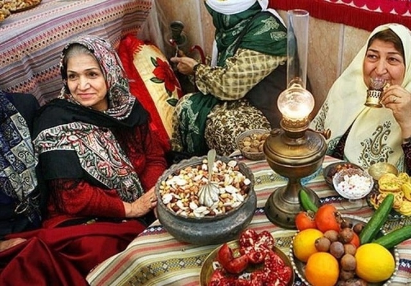 Yalda table with pomegranate and nuts on the chair; Photo source: blog.okcs.com. Photographer: Unknown