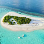 Aerial photo of one of the Maldivian islands; Photo Source: Forbes, Photographer: Unknown
