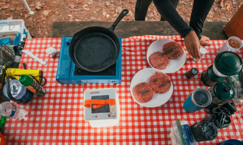 cooking hamburgers in nature; Photo source: luminaid.com. Photographer: Unknown