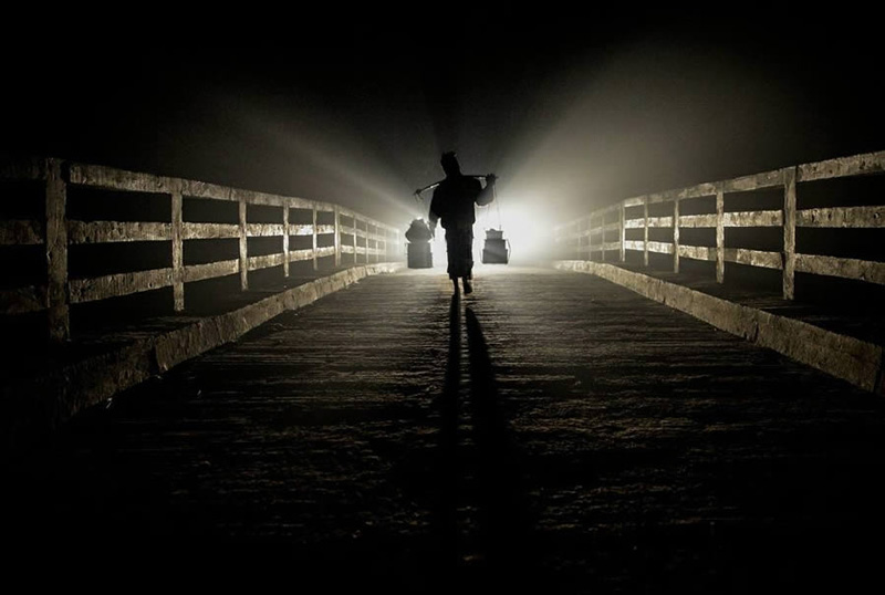 Pedestrian bridge in a wier night in Bangladesh; Photo source: 121clicks.com; Photographer: Mou Aysha