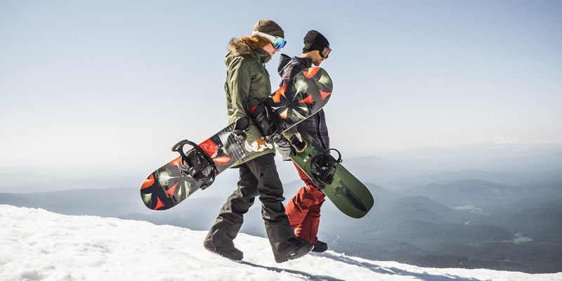 Snowboarding on snowy slopes; Photo source: rei.com; Photographer: Unknown