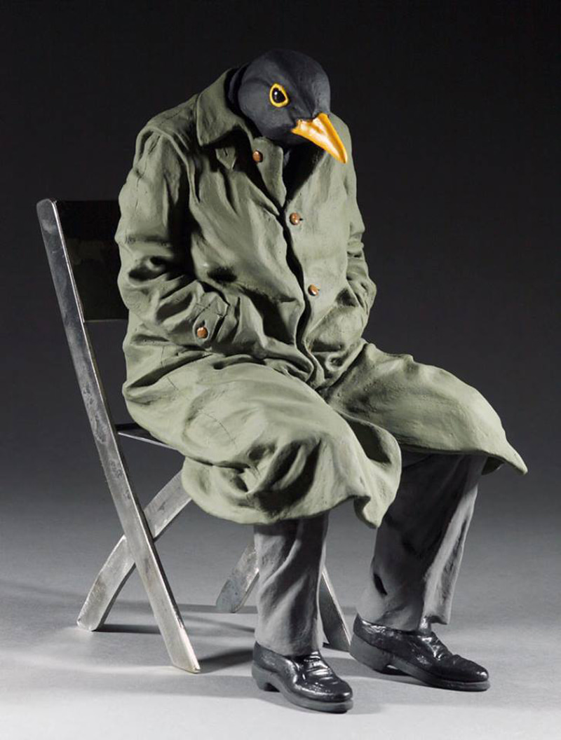 Ahropomorphic crow on a chair