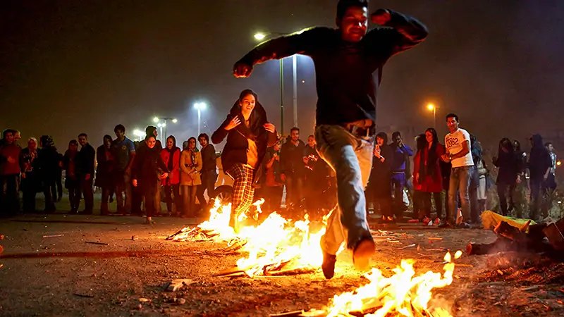 Jumping over the fire on Charsan Suri, photo source: robinarose.com, photographer: unknown