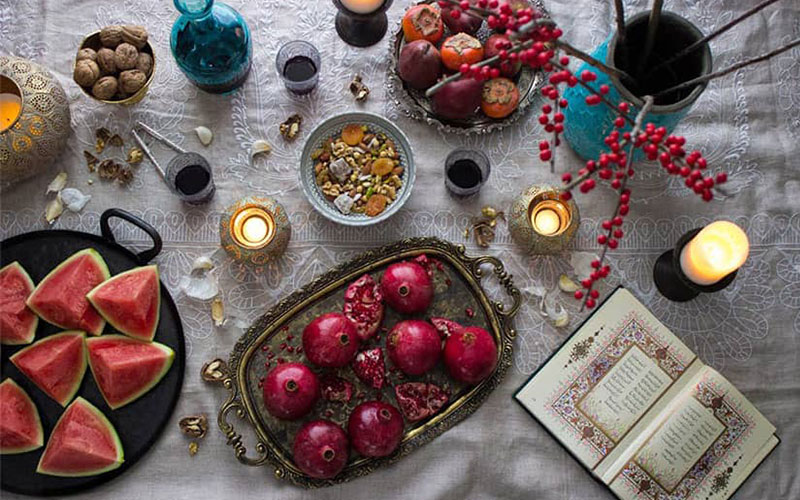 Yalda night table with pomegranate, Hafez and watermelon
